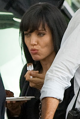 angelina jolie enjoying a chocolate cake