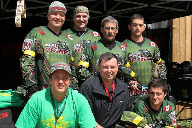 Tippinators pose for a photo with the movers and shakers from Tippmann Sports