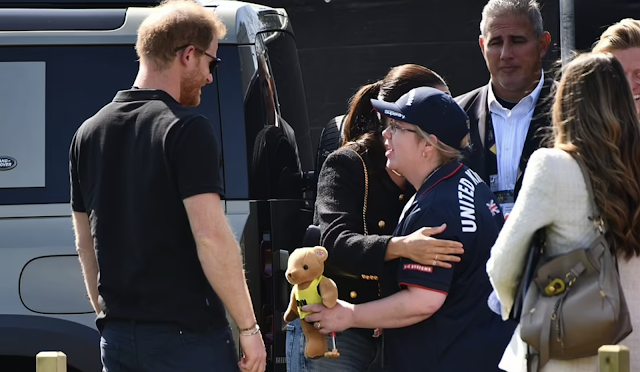 Meghan Markle and Prince Harry arrived at the Invictus Games yesterday flanked by five bodyguards including a former protector of Barack Obama.