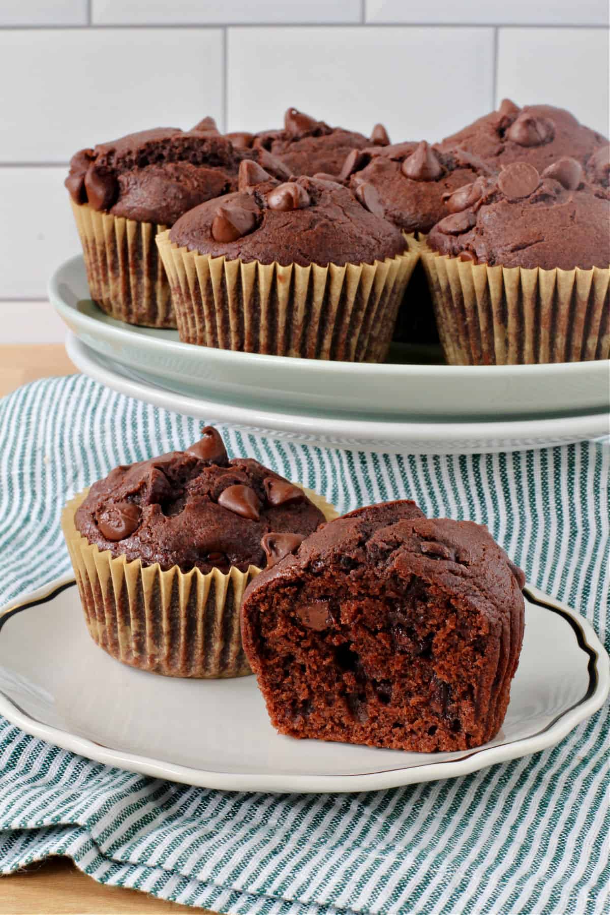 Sourdough Chocolate Muffins on a plate cut in half.