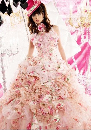 This pink wedding gown is densely decorated by flowers