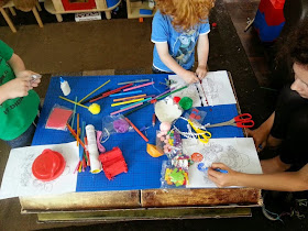 boys crafting at table