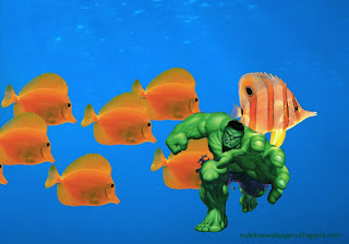 Desktop Wallpaper of The Incredible Hulk Trying to Grab You in Fishes Aquarium wallpaper