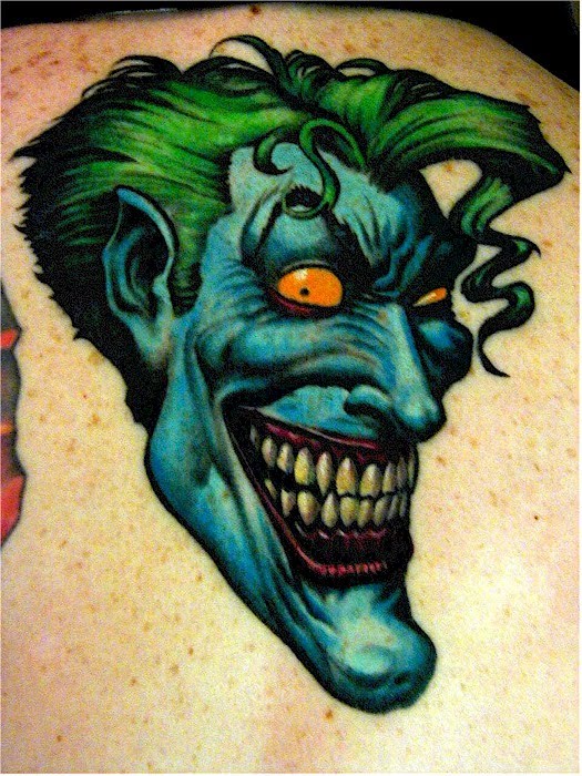 Cartoon joker tattoo.