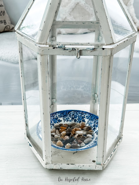 shallow bowl with stones in terrarium