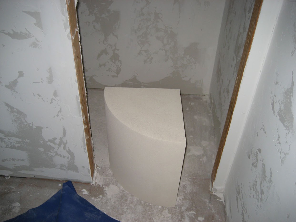 bathroom shower seat  bath will have a pre-formed quarter-circle seat covered with tile