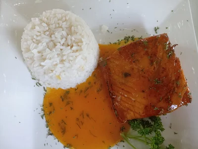 " Salmon cooked with passion fruit juice and rice from Rancho Chito in Santo Domingo"