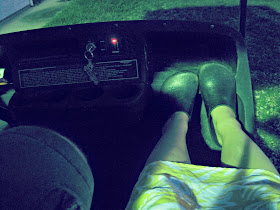 riding in a golf cart at night feet clogs