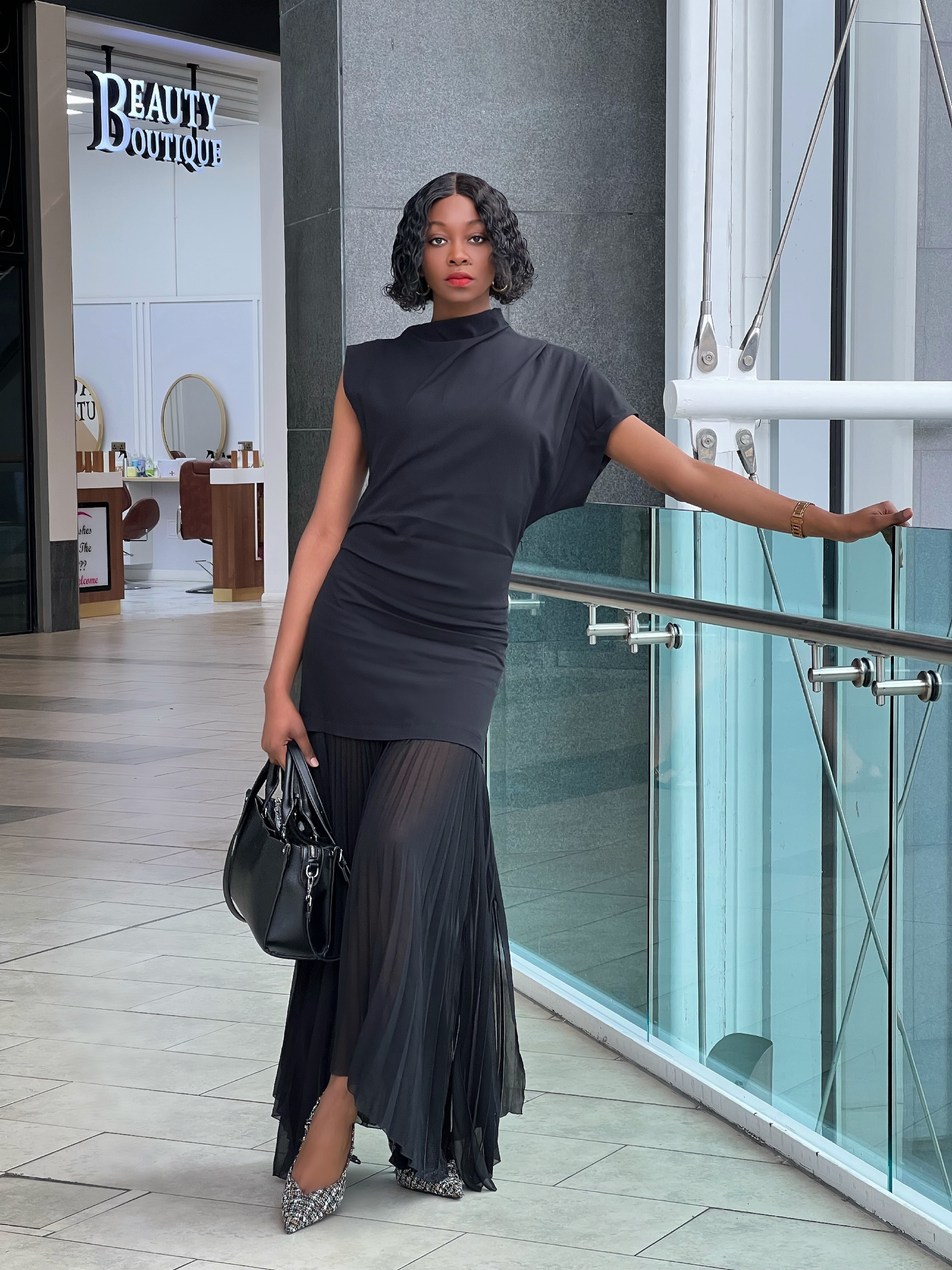 UK Fashion blogger wearing the zara limited edition black pleated dress