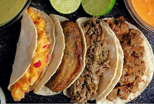four easy different types of trail tacos decorated on a table