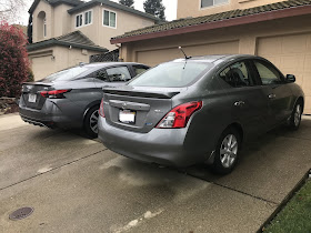 Rear 3/4 views of 2020 and 2013 Nissan Versa