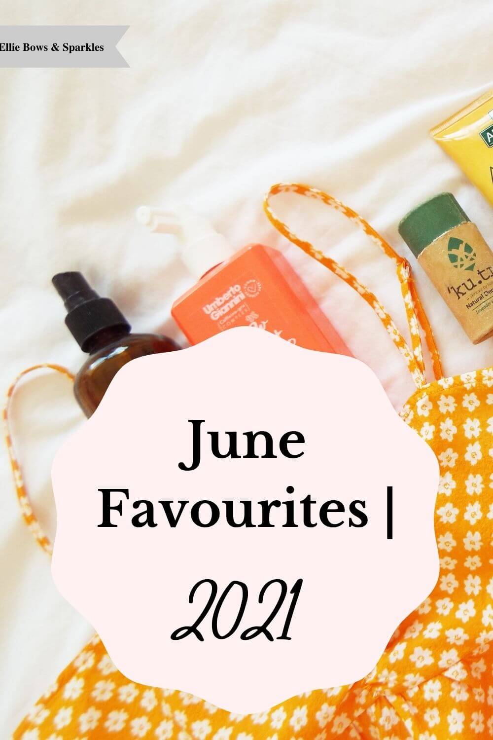 Pinterest pin with background filled with picture of brightly coloured beauty products and an orange floral dress on white bedding, with a pink, circular, frilly edged title card, reading June Favourites | 2021 in the centre.