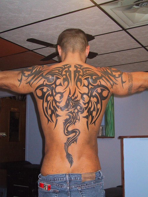  man with tattoos tribal upper back and shoulder tattoos tattoos back 