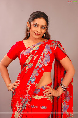 Meera Vasudevan in red colour printed saree