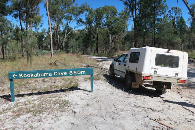 Kookaburra Cave sign with car parked beside