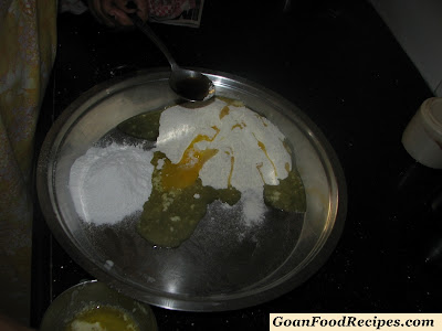 add egg yolk and vanilla essence to maida and sugar