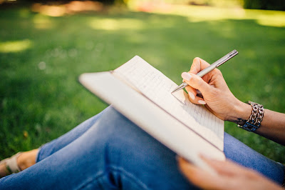 girl writing in notebook