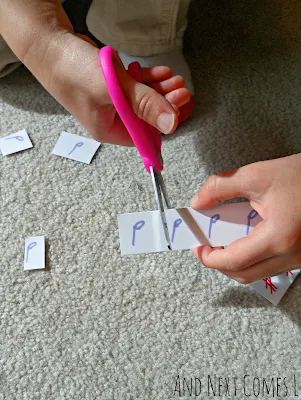 Close up of cutting music notation strips from And Next Comes L