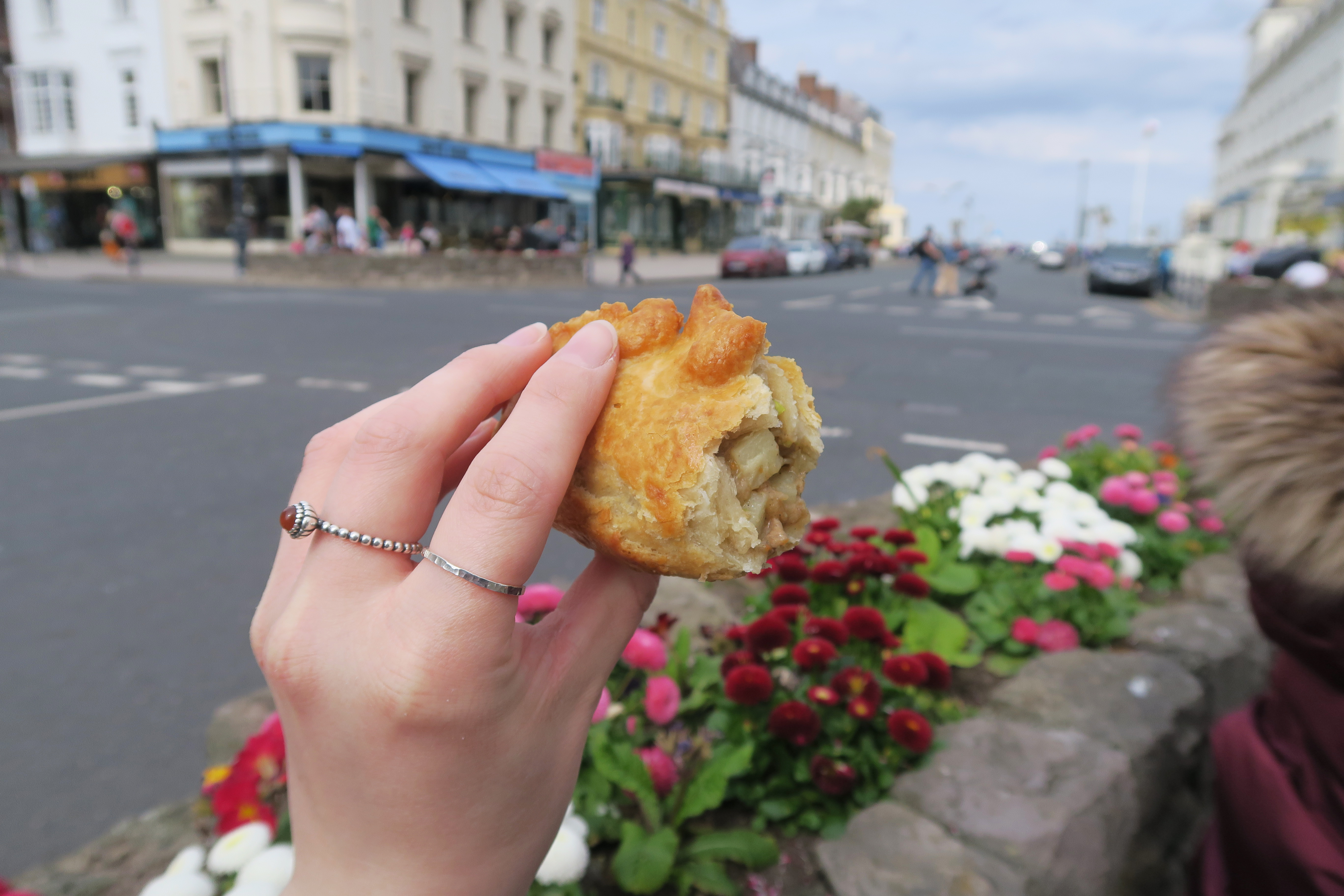 Holding a half eaten traditional Cornish pasty