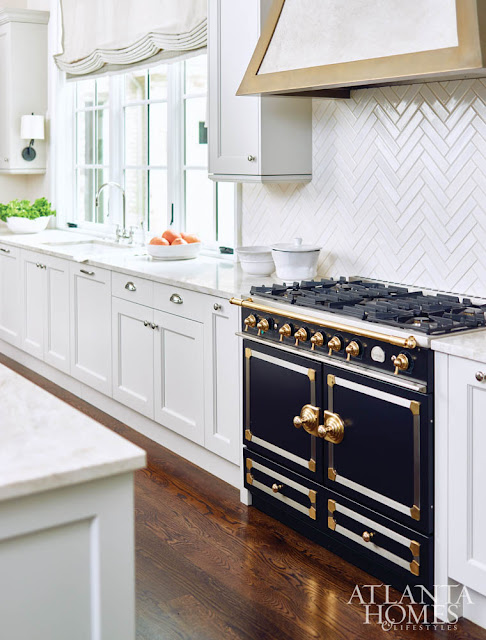 Black and Gold Vintage Style Range in White Glossy Kitchen