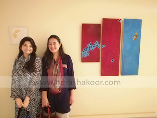 syeda hera shakoor with her work on display at NCA art gallery Rawalpindi