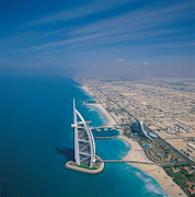 Burj Al Arab hotel in Dubai looks like a boat sailing the ocean. (burj al arab dubai hotel sail arab emirates )