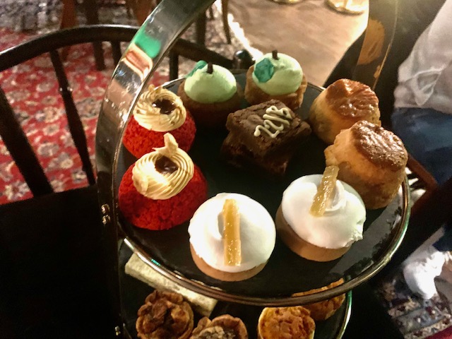 Cake stand with a selection of cakes, pastries and scones