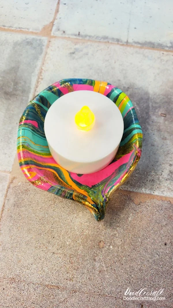 Add a battery powered candle to the diya for the perfect holiday lamp.   You could use a tea light as well, just use all the safety precautions.   I would not actually pour oil and put a wick in these diyas, as the paint will not do as well with the oil sitting in it.