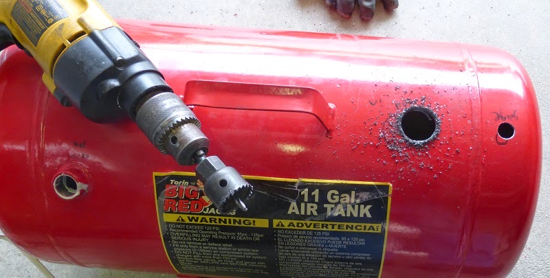 drilling hole in tank with hole saw