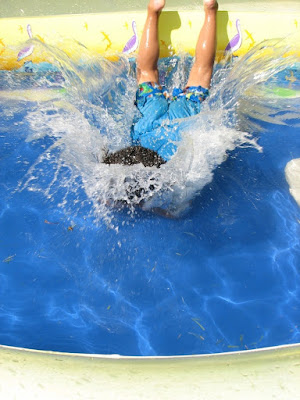 Picture of a child falling head first face down into the pool. Child drowning around water and our responsibility.