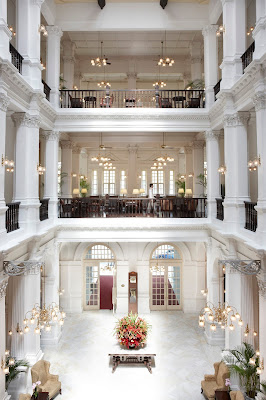 Source: Raffles Hotel, Singapore. The Grand  Lobby, Raffles Hotel, pre-renovation.