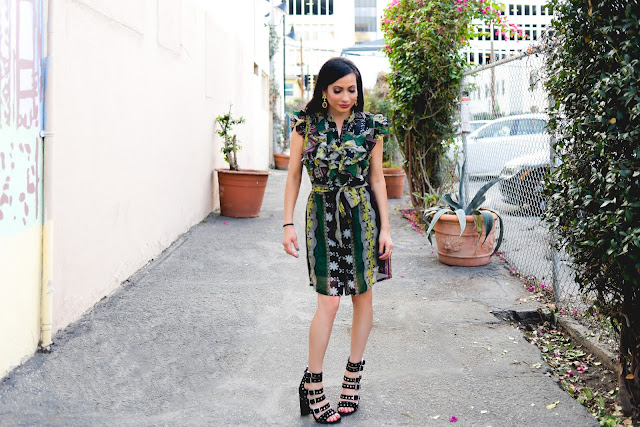 Joanna Joy A Stylish Love Story Blog Fashion Blog California Fashion Blogger tribal print green dress ruffles chunky grommet Sam Edelman black suede heels orange earrings