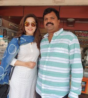 Mehreen Pirzada with Cute and Awesome Smile with Her Manager Mahendra Babu