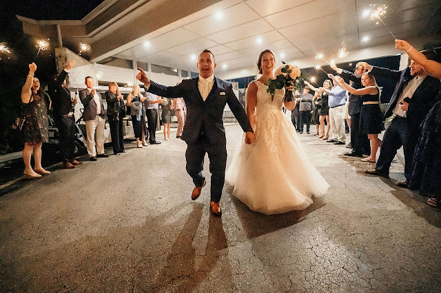 Bride and Groom exiting Reception