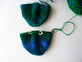 green and blue cable socks, about a quarter of the way through the foot is done