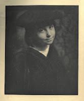 Photogravure of an adolescent looking at the camera smugly