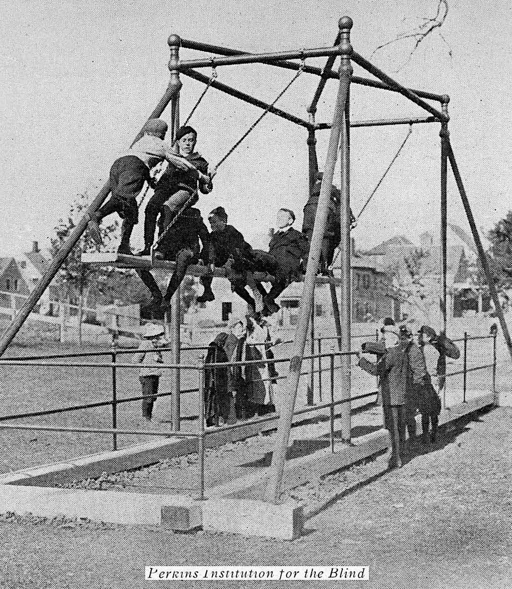 a 1912 school for the blind, blind children on a playground swing