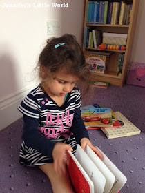 Toddler reading a book