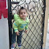 Baby Hang On The Gate