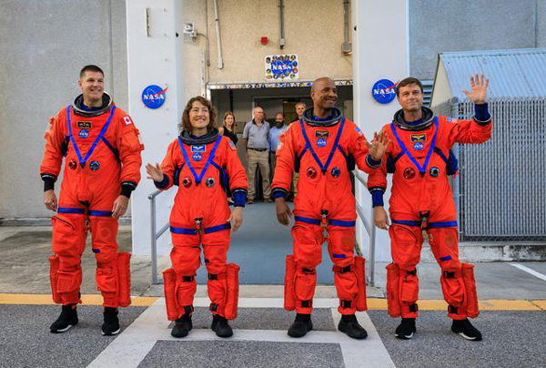 The Artemis 2 astronauts pose outside of the Neil Armstrong Operations and Checkout Building before heading to Launch Complex 39B at NASA's Kennedy Space Center in Florida...on September 20, 2023.