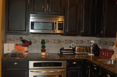 Kitchen Color Schemes  Black Cabinets on Black Speckled Granite That Only Made The Cabinets Look  Um  More Pink