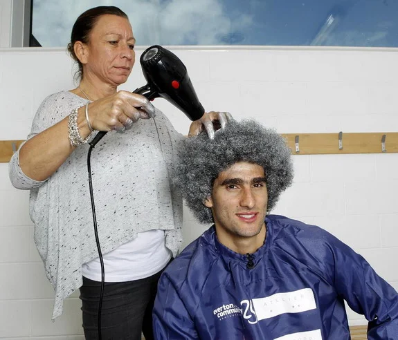 Marouane Fellaini turns his trademark Afro silver