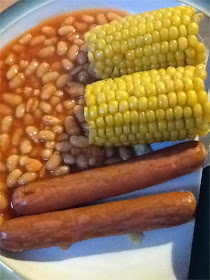 Princes hot dogs with corn on the cob and baked beans