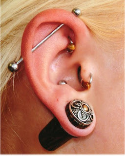 fine art Piercing the ear to the actress