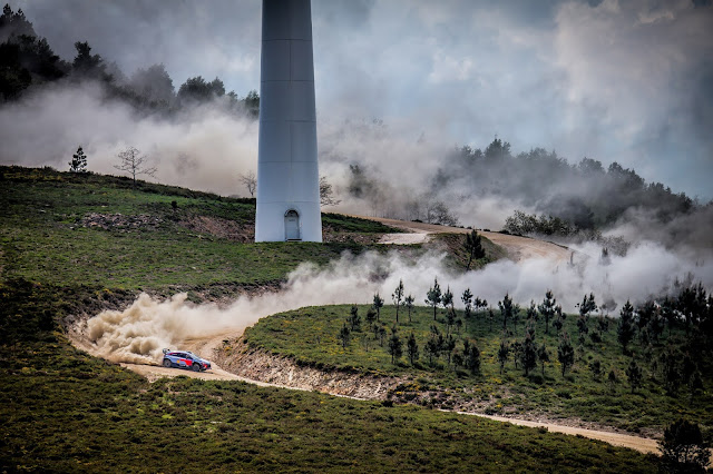 Dani Sordo WRC In Front of windmill with dust everywhere