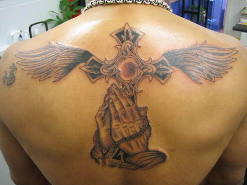 Source url:http://uniqtattoo.blogspot.com/2009/11/cross-praying-hands-wings- 