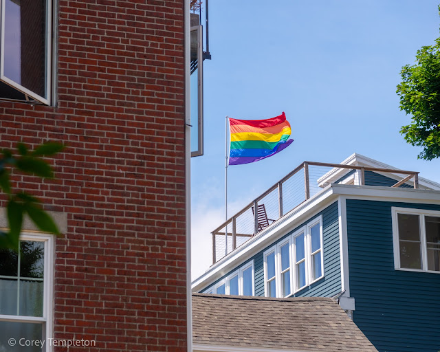 Portland, Maine USA June 2021 photo by Corey Templeton. A pride flag enjoying the breeze high above the West End.