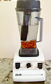 Vitamix filled with water and almonds