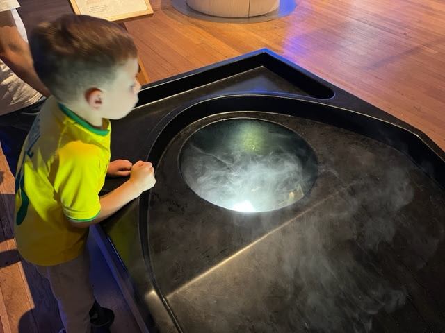 Boy having fun in Wonderlab, the Science Museum
