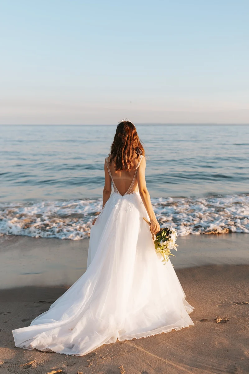 a beautiful bride in a tight wedding dressa